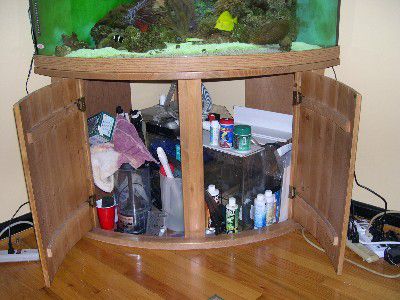 Disorganized aquarium cabinet