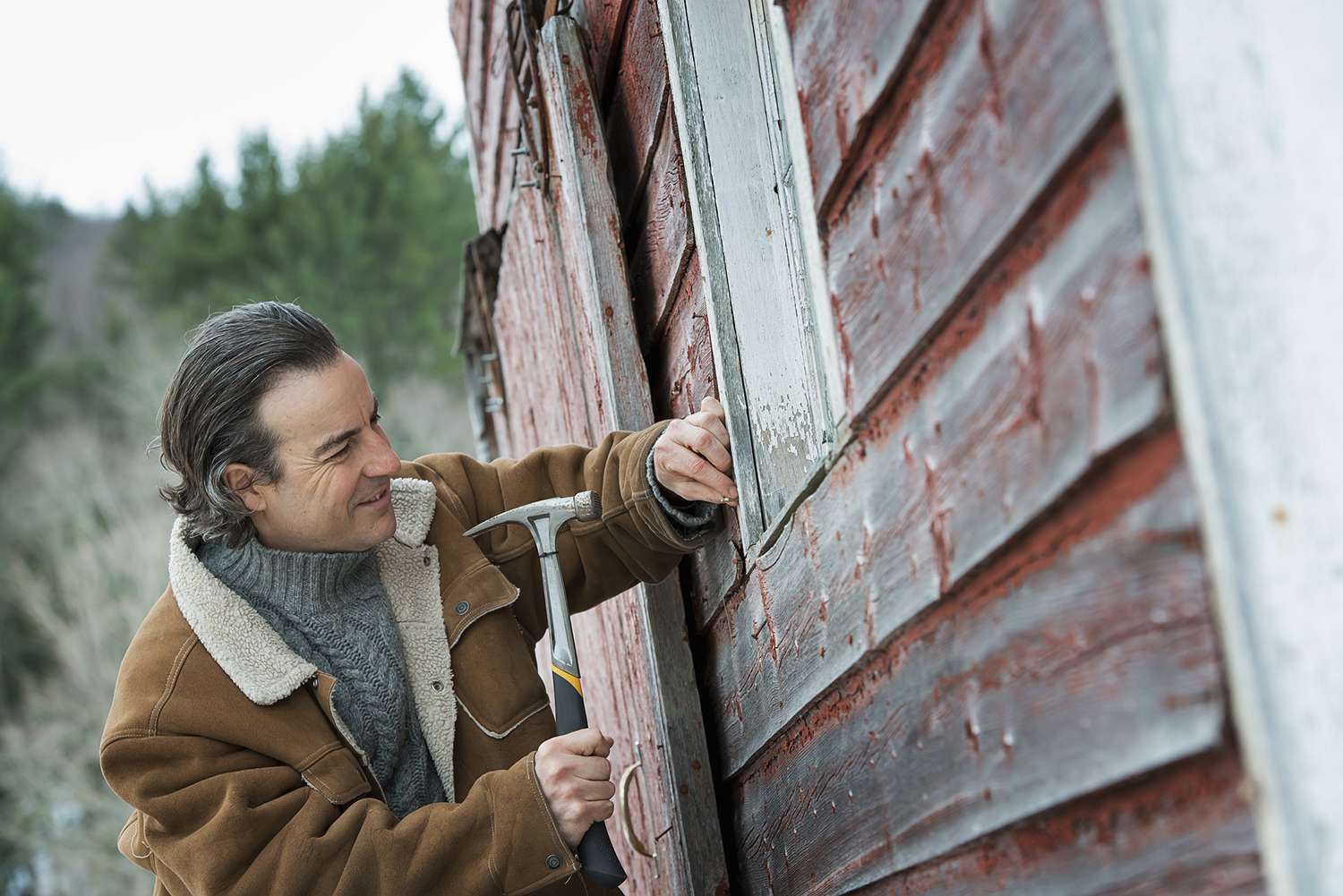 A Man Repairing a Barn