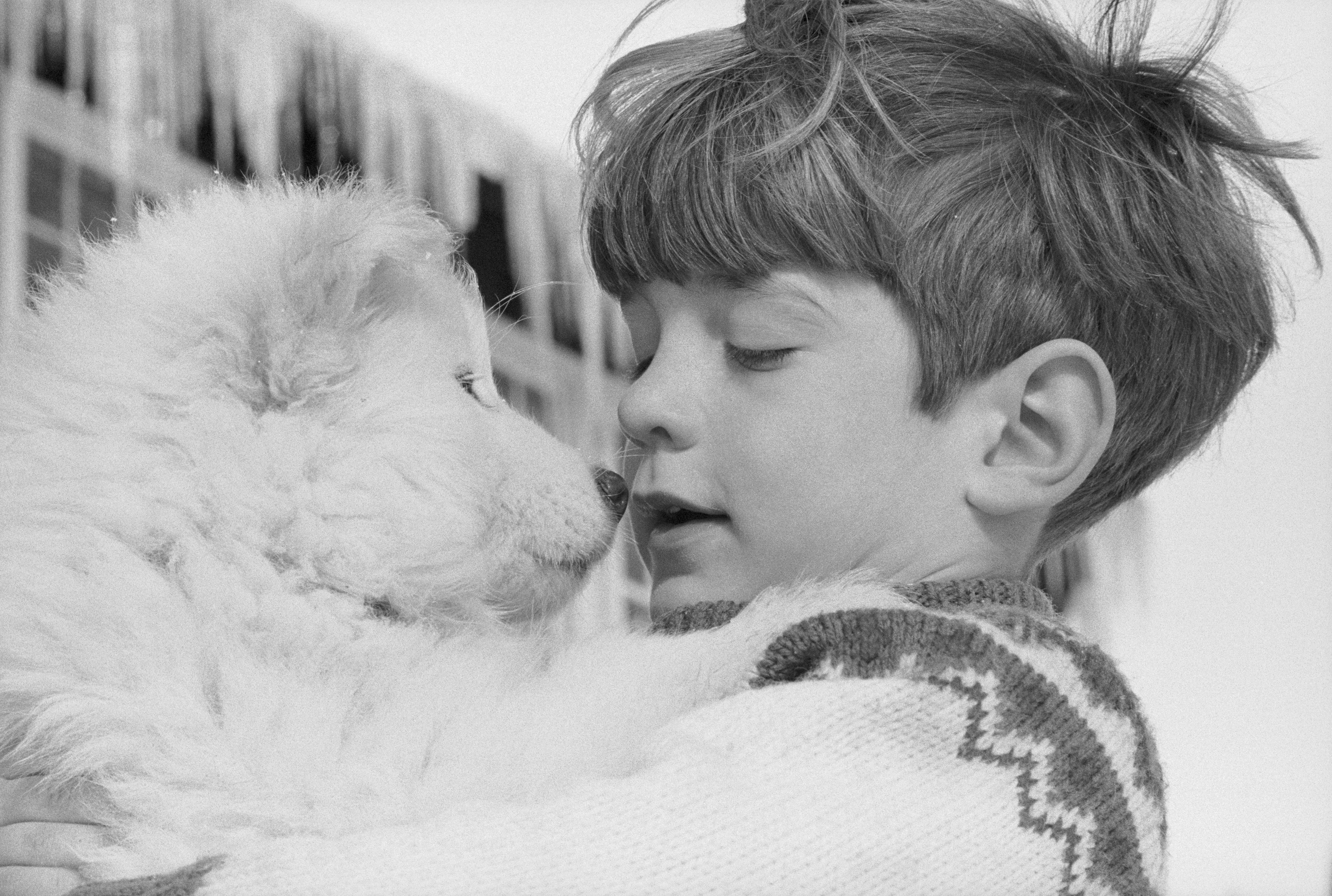 John F. Kenney Jr. holding samoyed puppy
