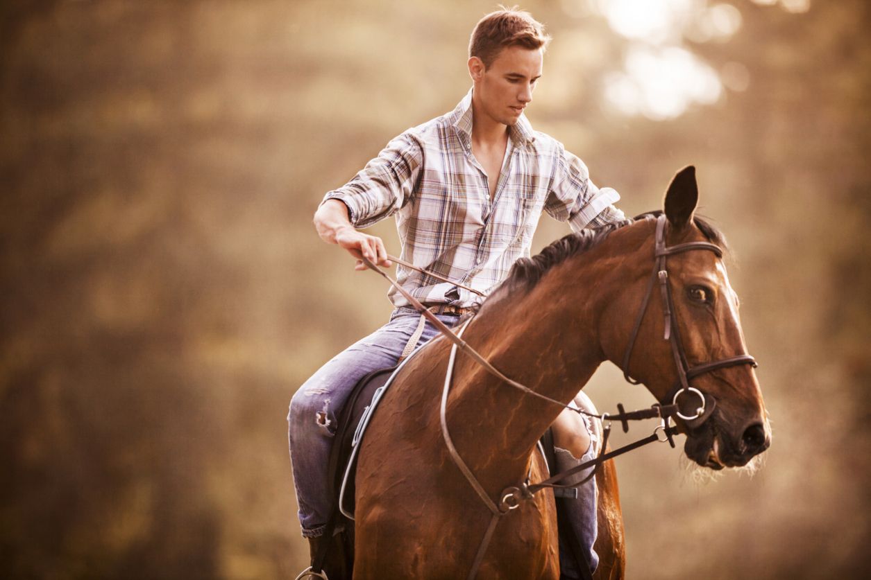 Man struggling to control horse