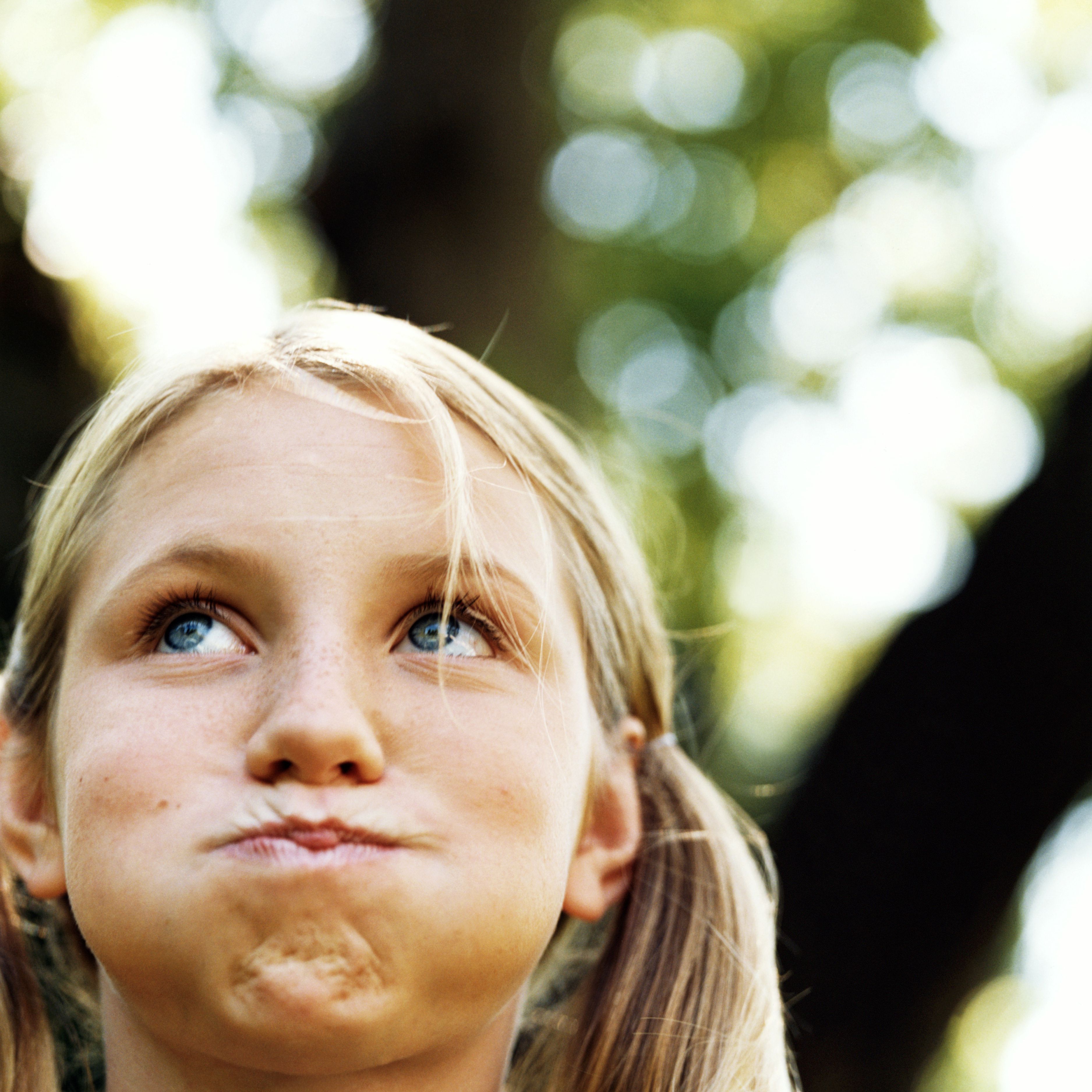 Teenage girl (13-15) holding breath