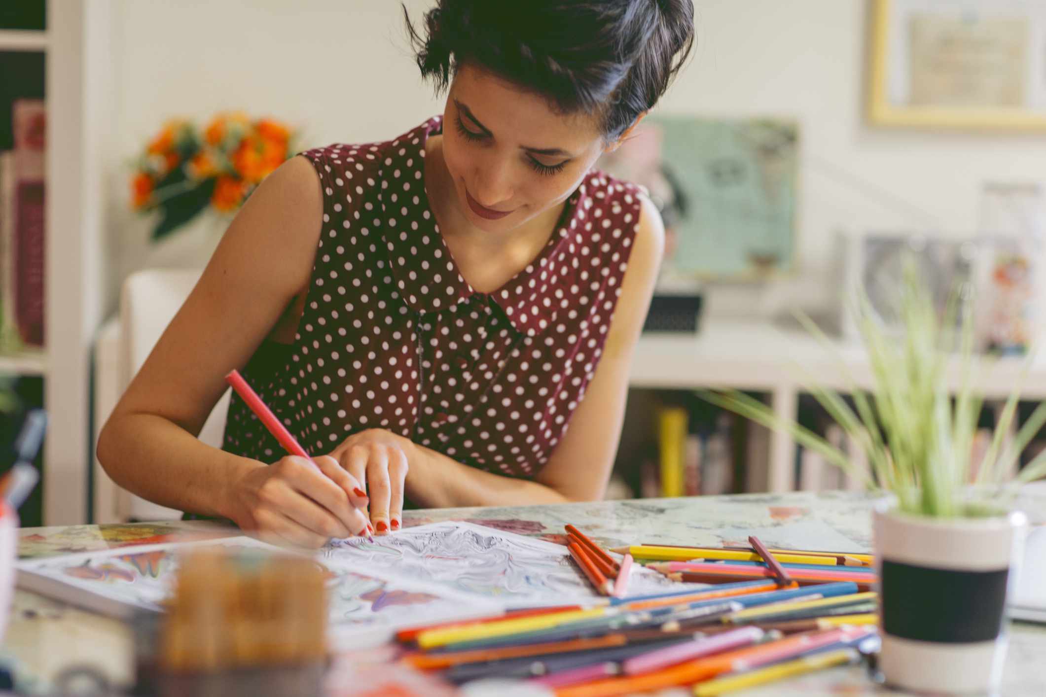 Woman using adult coloring book